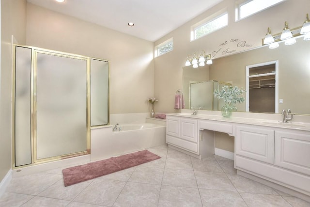 204 Whippoorwill Cv, Georgetown, TX 78633 - full bath featuring a stall shower, a garden tub, double vanity, and tile patterned flooring