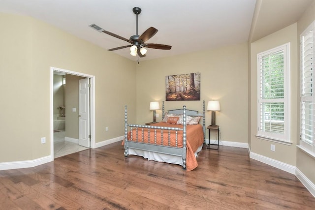 204 Whippoorwill Cv, Georgetown, TX 78633 - bedroom with wood finished floors, baseboards, and connected bathroom