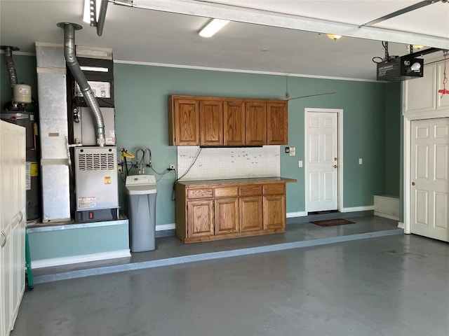 204 Whippoorwill Cv, Georgetown, TX 78633 - garage with a garage door opener, baseboards, and heating unit