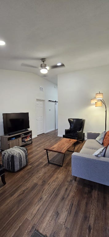 living room featuring a ceiling fan, recessed lighting, and wood finished floors