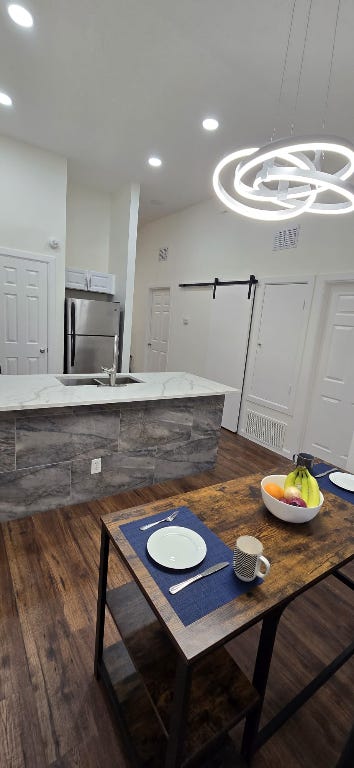 dining area featuring recessed lighting and dark wood-style floors