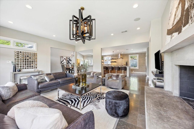 2304 Mccullough St, Austin, TX 78703 - living room featuring a chandelier, recessed lighting, and a fireplace