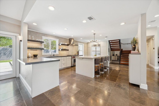 2304 Mccullough St, Austin, TX 78703 - kitchen with stainless steel range, a sink, a breakfast bar, open shelves, and tasteful backsplash