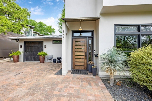 2304 Mccullough St, Austin, TX 78703 - doorway to property with stucco siding