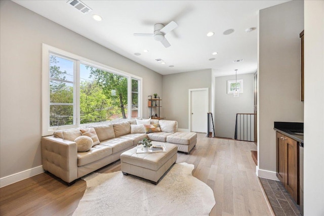 2304 Mccullough St, Austin, TX 78703 - living area with wood finished floors, ceiling fan, recessed lighting, and baseboards