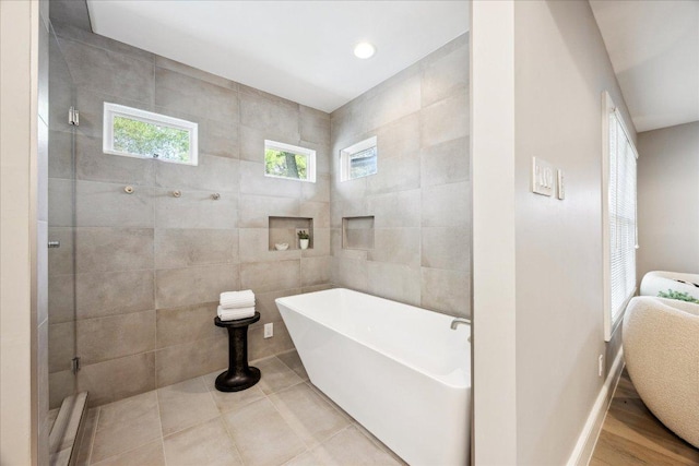 2304 Mccullough St, Austin, TX 78703 - full bath with tile walls, a soaking tub, and a shower stall
