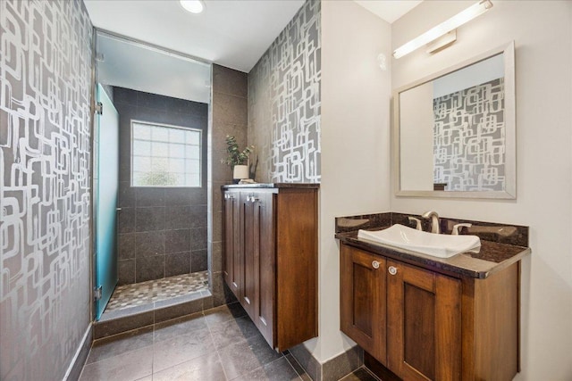 2304 Mccullough St, Austin, TX 78703 - full bathroom featuring vanity, a tile shower, and tile patterned flooring