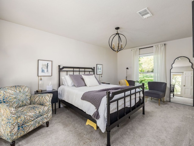 6022 Tonkowa Trl, Georgetown, TX 78628 - bedroom with light colored carpet and a chandelier