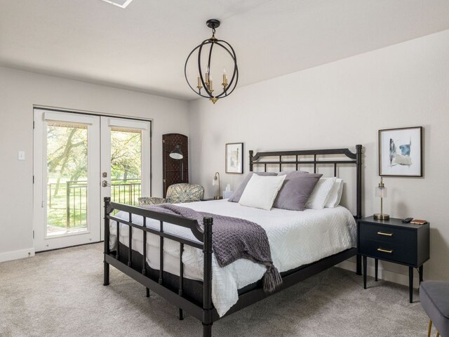 6022 Tonkowa Trl, Georgetown, TX 78628 - bedroom with a chandelier, access to exterior, carpet flooring, and french doors