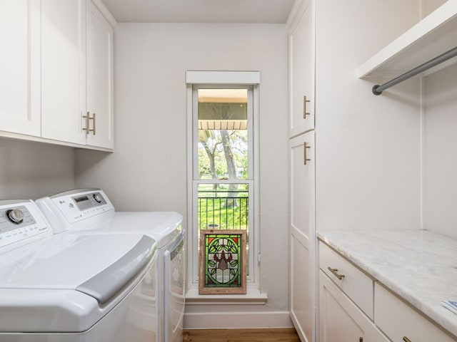 6022 Tonkowa Trl, Georgetown, TX 78628 - washroom featuring cabinet space, washing machine and clothes dryer, and wood finished floors