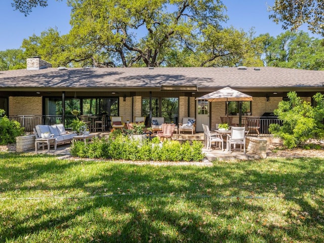 6022 Tonkowa Trl, Georgetown, TX 78628 - back of house featuring brick siding, a patio area, and a yard