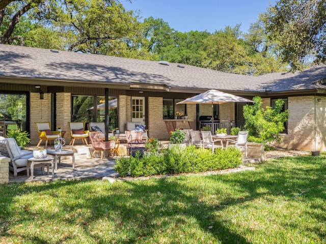 6022 Tonkowa Trl, Georgetown, TX 78628 - back of house featuring roof with shingles, a yard, and brick siding