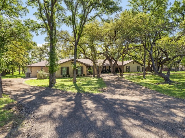 6022 Tonkowa Trl, Georgetown, TX 78628 - single story home with driveway and a front lawn