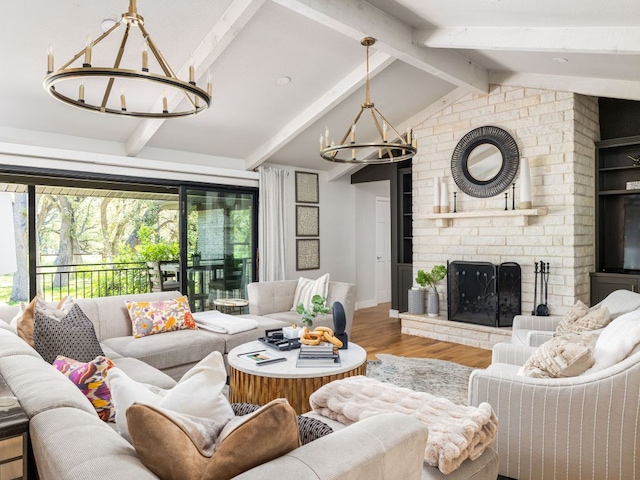 6022 Tonkowa Trl, Georgetown, TX 78628 - living area featuring a chandelier, wood finished floors, and a fireplace