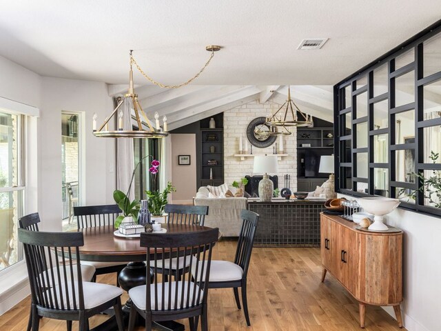 6022 Tonkowa Trl, Georgetown, TX 78628 - dining area featuring healthy amount of natural light, light wood-style floors, and a chandelier