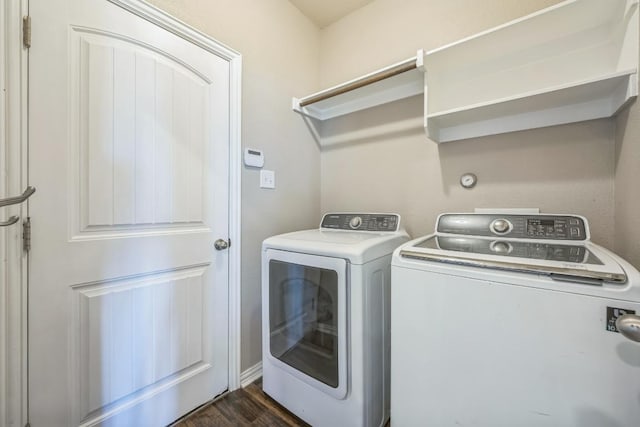 3505 Grail Hollows Rd, Pflugerville, TX 78660 - laundry room with washing machine and dryer and dark wood-style flooring