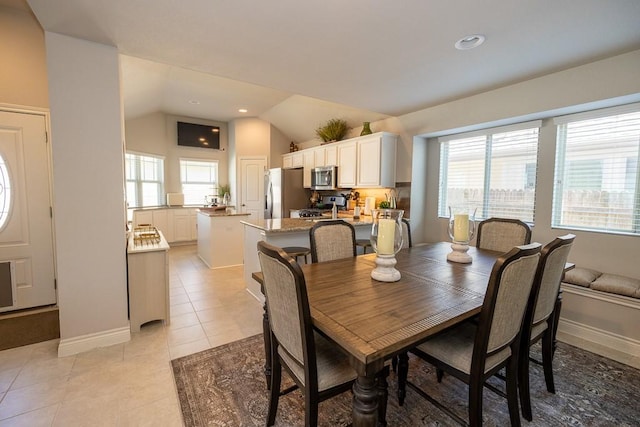 702 Silo St, San Marcos, TX 78666 - dining room featuring lofted ceiling, light tile patterned floors, and recessed lighting