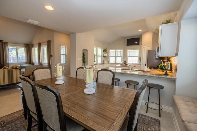 702 Silo St, San Marcos, TX 78666 - tiled dining area featuring lofted ceiling and recessed lighting