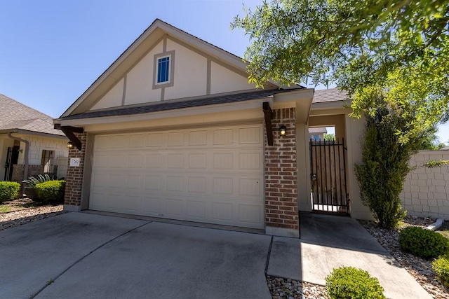 702 Silo St, San Marcos, TX 78666 - view of front facade featuring concrete driveway, brick siding, and stucco siding