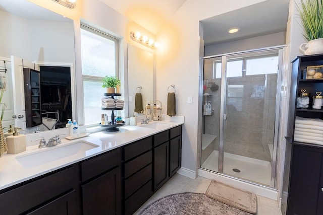 702 Silo St, San Marcos, TX 78666 - full bath featuring double vanity, a stall shower, and tile patterned flooring