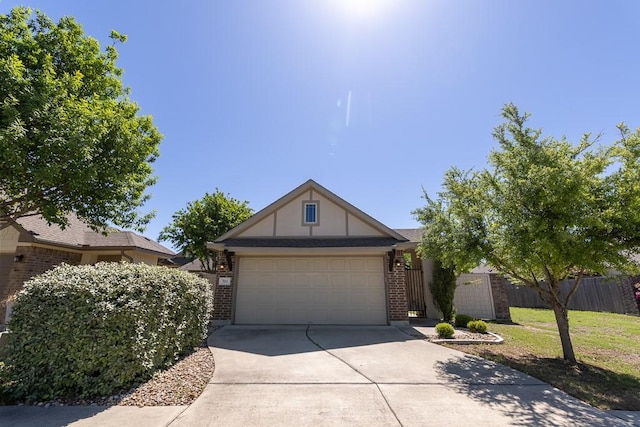 702 Silo St, San Marcos, TX 78666 - view of front of house with brick siding, driveway, and an attached garage