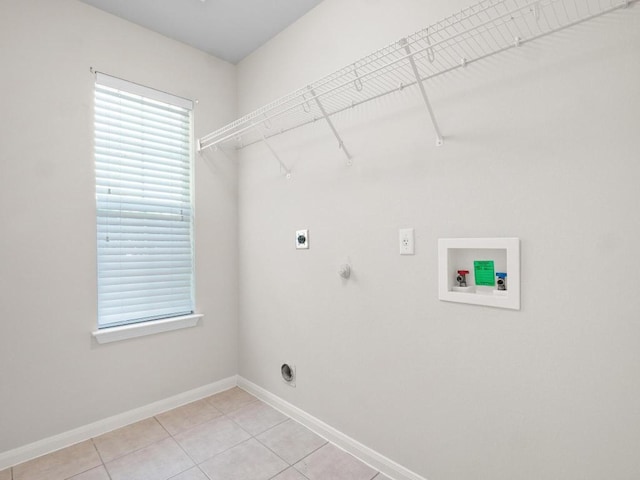 429 Falcon Ln, Leander, TX 78641 - washroom with hookup for an electric dryer, washer hookup, light tile patterned floors, and hookup for a gas dryer