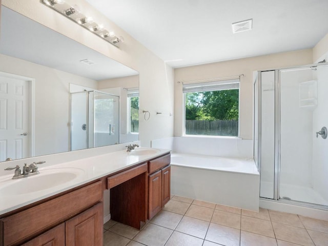 429 Falcon Ln, Leander, TX 78641 - full bath with a shower stall, a garden tub, double vanity, and tile patterned flooring