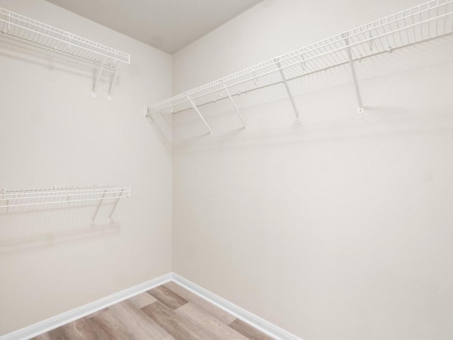 429 Falcon Ln, Leander, TX 78641 - spacious closet featuring wood finished floors