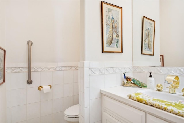 901 Blaylock Dr, Salado, TX 76571 - half bath featuring vanity, tile walls, and a wainscoted wall