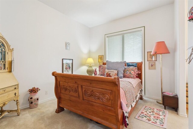 901 Blaylock Dr, Salado, TX 76571 - bedroom featuring light carpet and baseboards