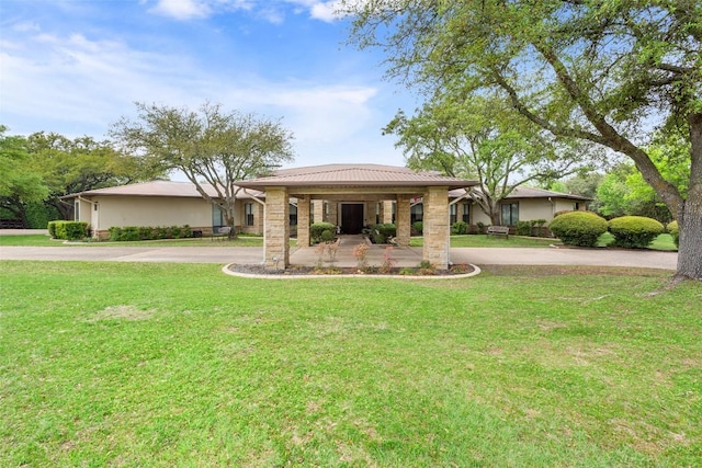 901 Blaylock Dr, Salado, TX 76571 - view of front of property with a front lawn, curved driveway, and stone siding