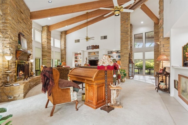 901 Blaylock Dr, Salado, TX 76571 - carpeted dining area with a stone fireplace, high vaulted ceiling, a ceiling fan, beam ceiling, and recessed lighting