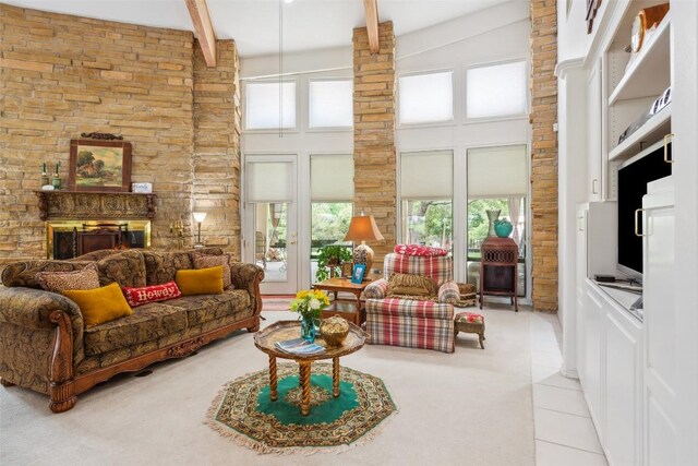 901 Blaylock Dr, Salado, TX 76571 - living area with a towering ceiling, beam ceiling, light tile patterned flooring, and light colored carpet