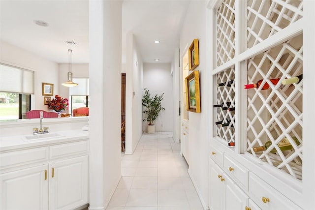 901 Blaylock Dr, Salado, TX 76571 - wine room with light tile patterned flooring and recessed lighting