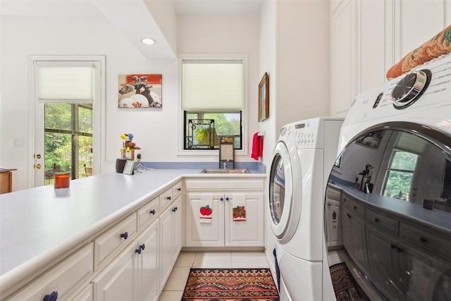 901 Blaylock Dr, Salado, TX 76571 - washroom with washing machine and clothes dryer, cabinet space, light tile patterned floors, and recessed lighting