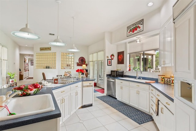 901 Blaylock Dr, Salado, TX 76571 - kitchen featuring stainless steel dishwasher, black microwave, white cabinets, tasteful backsplash, and recessed lighting