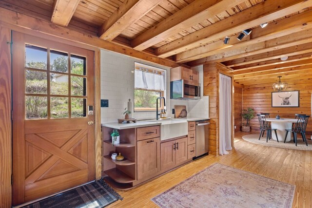 210 Circle Rd, Marble Falls, TX 78657 - kitchen featuring stainless steel appliances, a sink, open shelves, wooden ceiling with exposed beams, and light wood-style floors