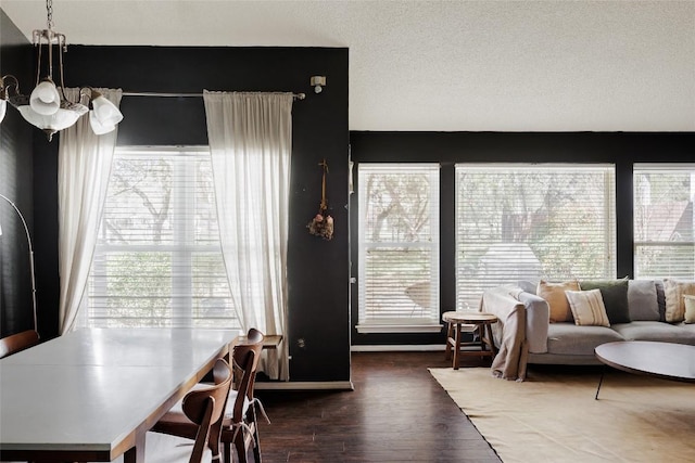 19 Deerfield Dr Unit 2, Wimberley, TX 78676 - living area featuring wood finished floors and a chandelier