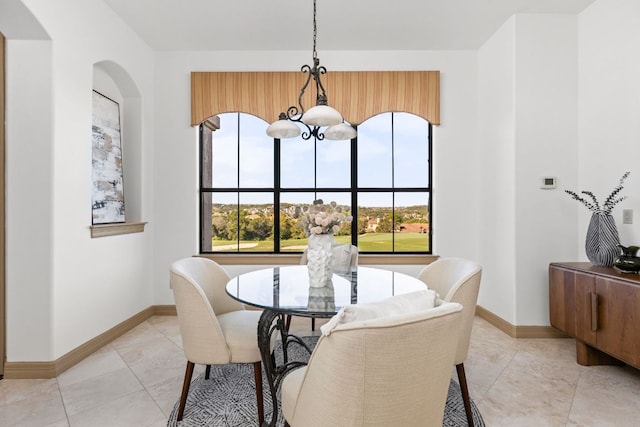 219 Jack Nicklaus Dr, Austin, TX 78738 - dining space with a chandelier, arched walkways, and light tile patterned flooring