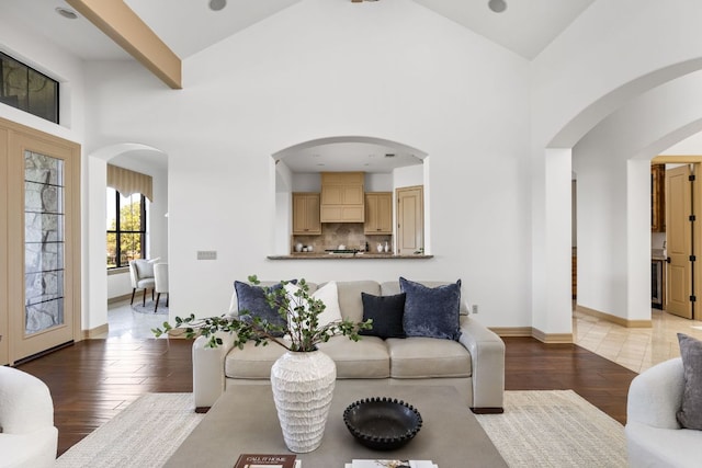 219 Jack Nicklaus Dr, Austin, TX 78738 - living area featuring high vaulted ceiling, light wood finished floors, and arched walkways