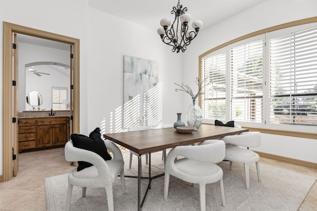219 Jack Nicklaus Dr, Austin, TX 78738 - dining room featuring a chandelier, lofted ceiling, light tile patterned flooring, and ceiling fan