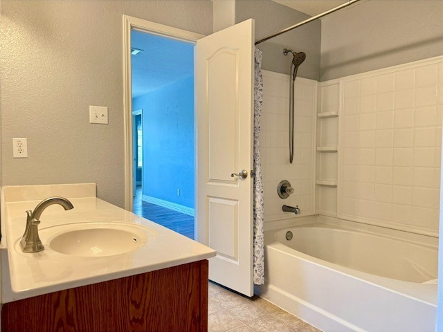2201 Ezra Ct, Cedar Park, TX 78613 - bathroom featuring shower / tub combo, a textured wall, vanity, and tile patterned flooring