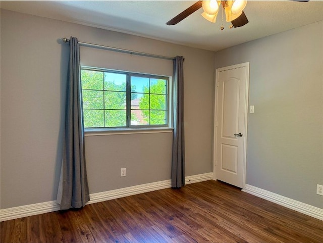 2201 Ezra Ct, Cedar Park, TX 78613 - spare room with dark wood-type flooring, baseboards, and ceiling fan