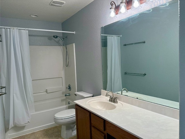 2201 Ezra Ct, Cedar Park, TX 78613 - bathroom with vanity, shower / tub combo, toilet, a textured wall, and tile patterned flooring