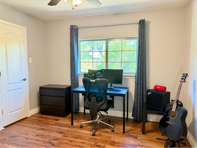 2201 Ezra Ct, Cedar Park, TX 78613 - office with wood finished floors, a ceiling fan, and baseboards