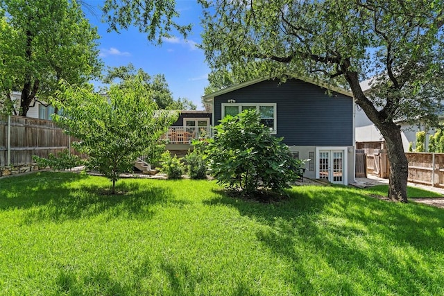 2004 Raleigh Ave, Austin, TX 78703 - back of property featuring french doors, a deck, and a fenced backyard