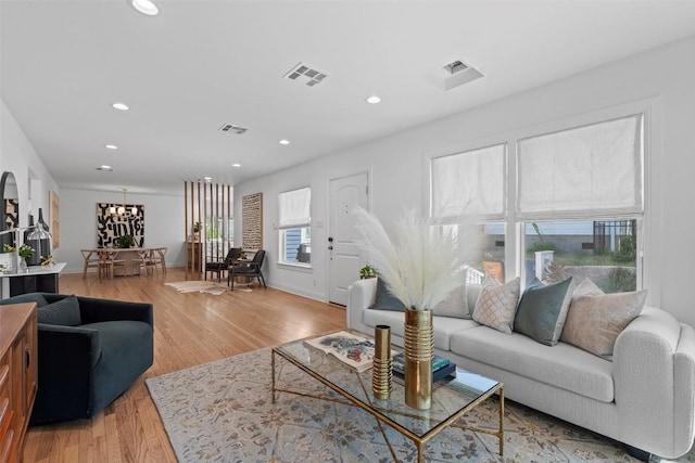 2004 Raleigh Ave, Austin, TX 78703 - living area with recessed lighting, light wood-style floors, and a chandelier