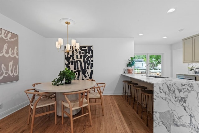 2004 Raleigh Ave, Austin, TX 78703 - dining space with wood finished floors, a chandelier, and recessed lighting