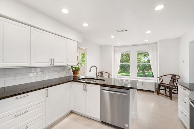 13212 Running Doe Ln, Cedar Park, TX 78613 - kitchen with stainless steel dishwasher, a sink, dark stone countertops, backsplash, and recessed lighting