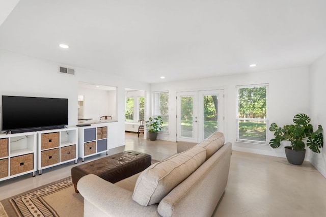 13212 Running Doe Ln, Cedar Park, TX 78613 - living room featuring recessed lighting, baseboards, concrete flooring, and french doors